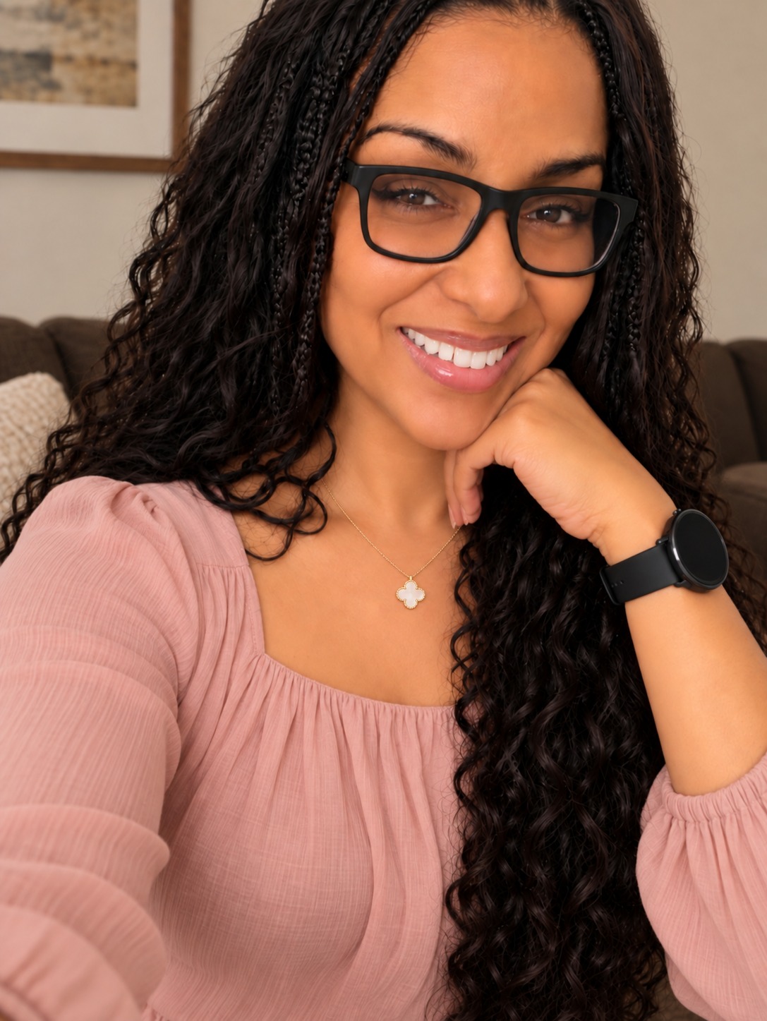 Ilea Martinez, creator of The Cozy Footprint, smiling in a pink blouse.